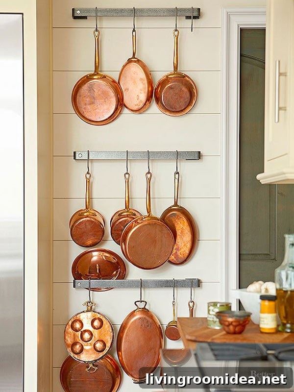 Copper pots hung on wall - kitchen organization
