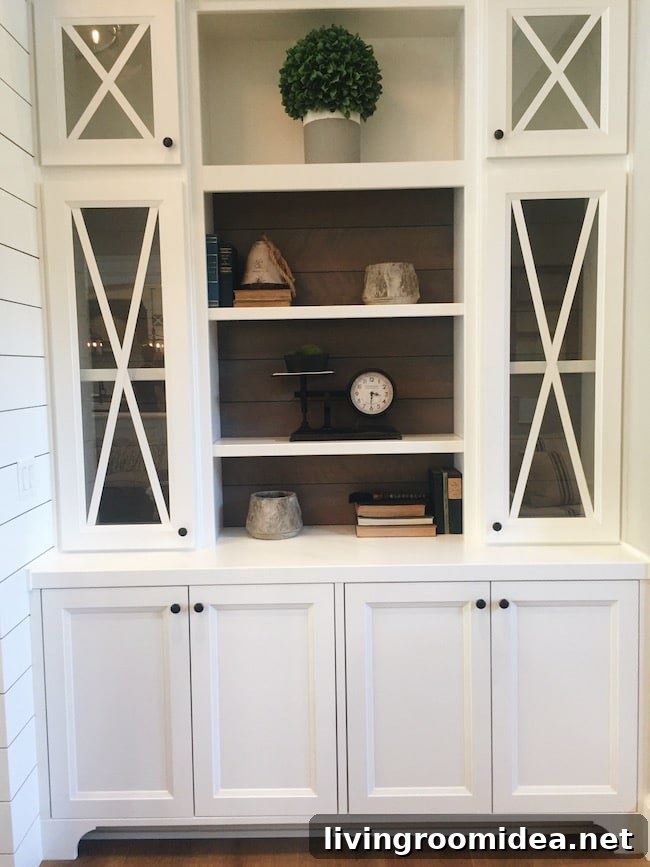 Inside a Modern Farmhouse: Street of Dreams Home Tour 23 Built in Design - White Cabinet with X Glass Doors - Wood Shiplap Back - Street of Dreams