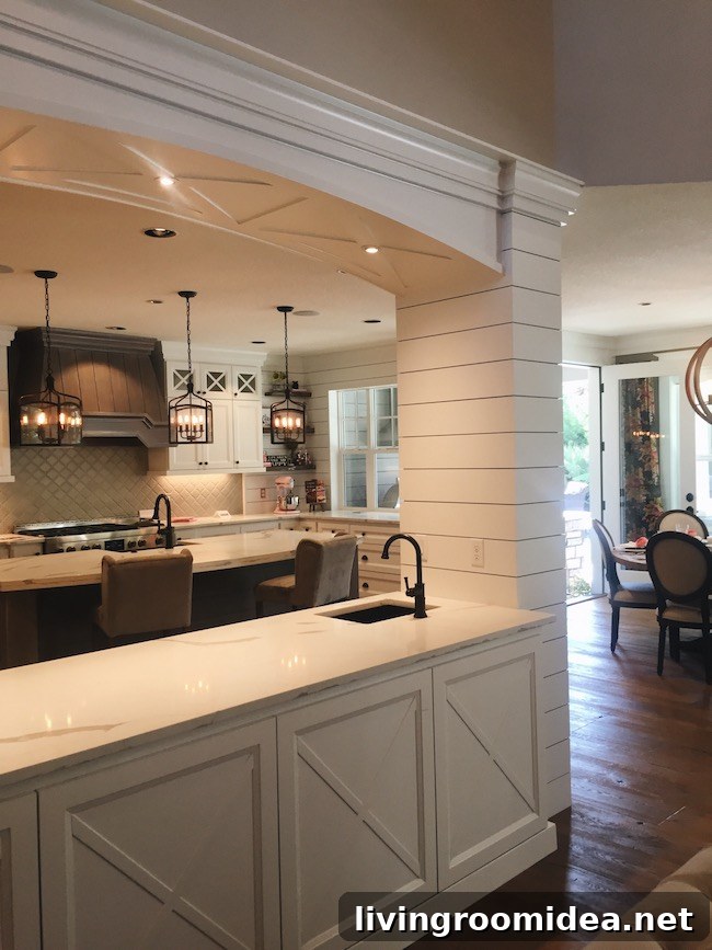 Inside a Modern Farmhouse: Street of Dreams Home Tour 8 Kitchen - X Trim detail - Shiplap - Range Hood Dark Hood