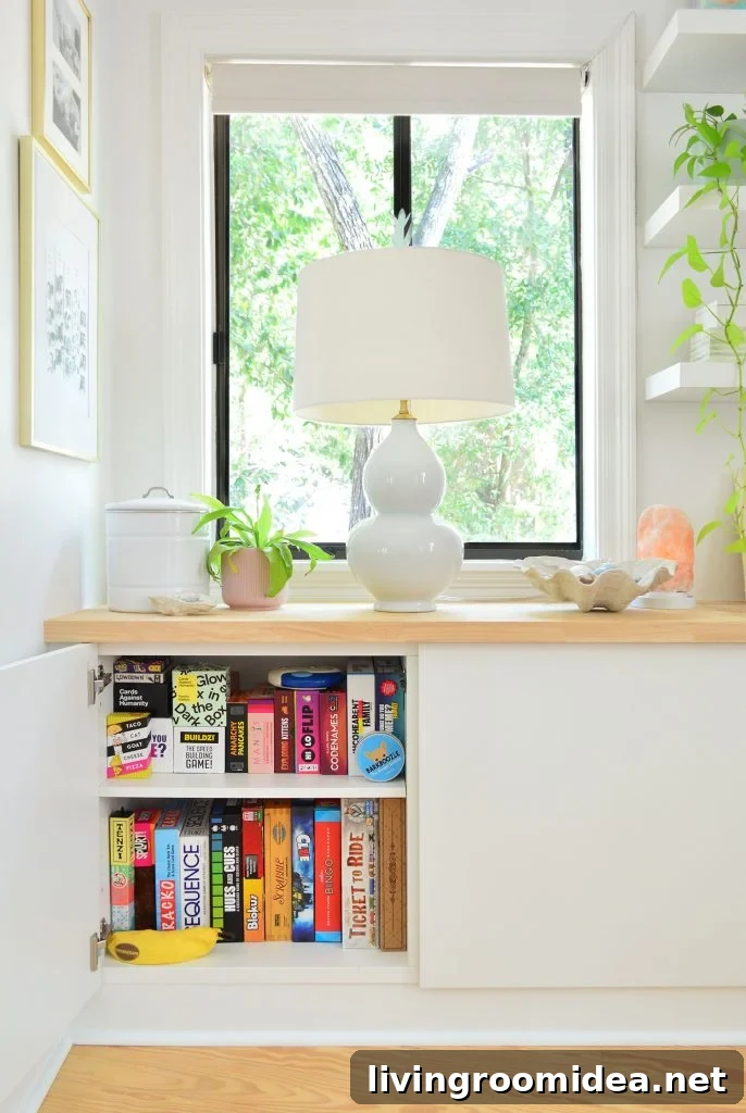 Ikea Besta Cabinet With Door Open Showing Family Board Game Storage