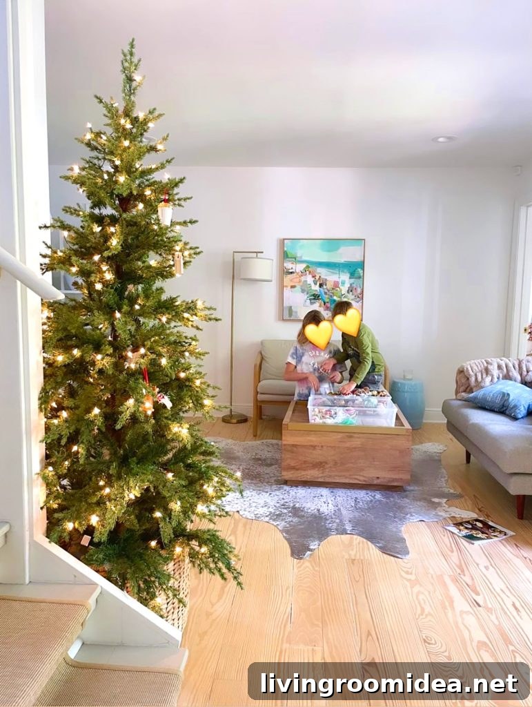 Christmas Tree undecorated in kitchen with children grabbing ornaments in background