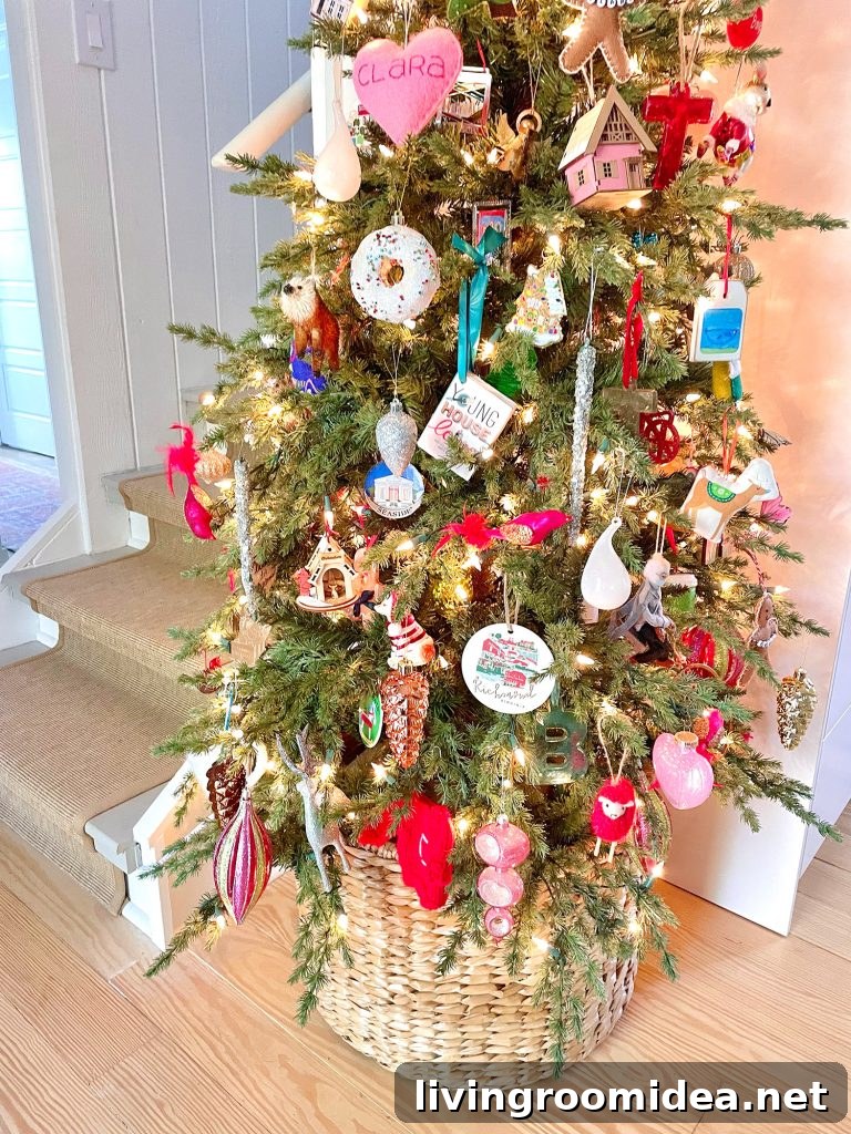 Detail of ornaments on narrow Christmas tree in kitchen in wicker basket
