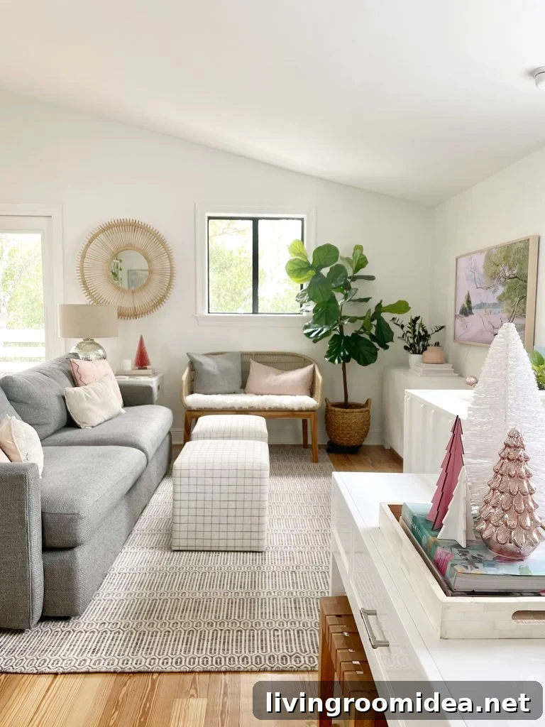 Wide view of living room with new sheepskin loveseat and decorative Christmas trees on tabletop