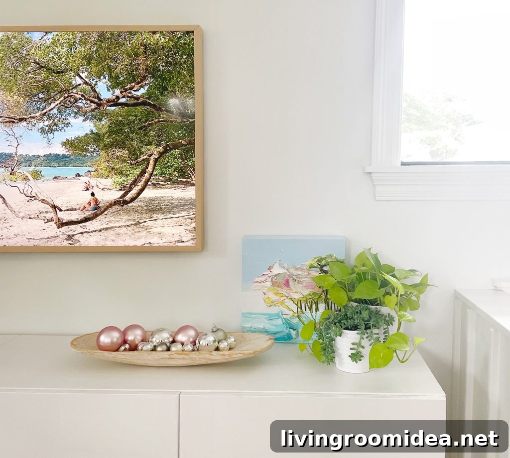 Shallow dish of ornaments as tabletop decor on media console