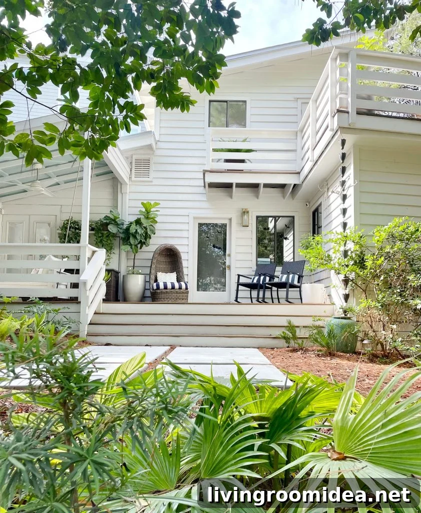 Exterior Of White Modern Home With Siding And Florida Landscaping