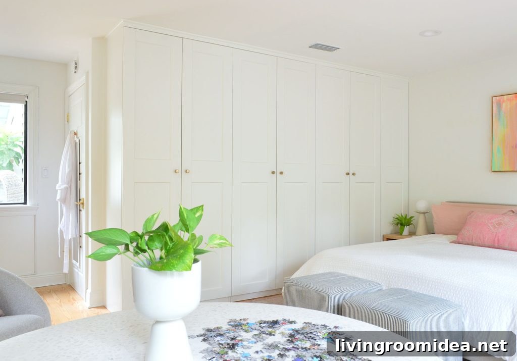 Row of Ikea Pax Wardrobes In Bedroom With Puzzle Table In Foreground
