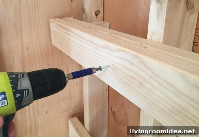 DIY Garage Shelving: Step-by-Step Guide to Build Durable Shelves 6 screwing in horizontal support for DIY garage shelf