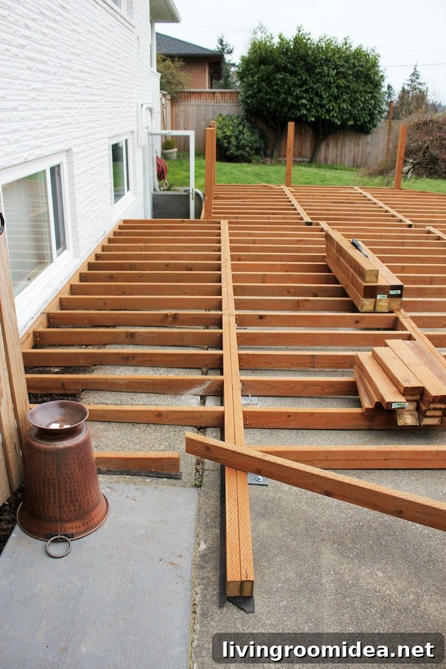 Trex Deck Build Progress: Mid-Project Photos and Sneak Peek 4 installing a Trex deck over existing concrete patio