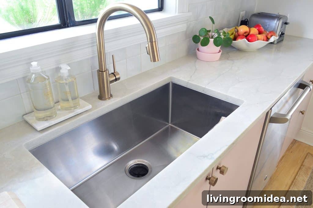 Deep Stainless Steel Sink And Gray Natural Quartz Countertops