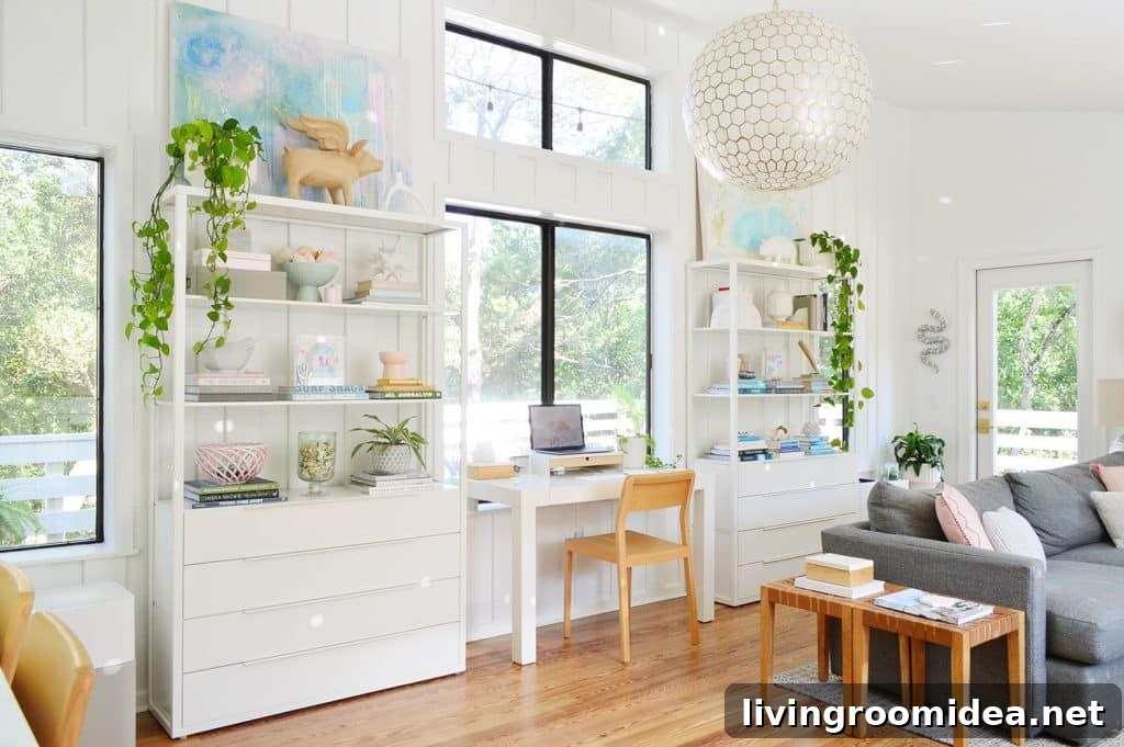 Light filled upstairs family room with Ikea fjalkinge shleves and west elm Parsons desk