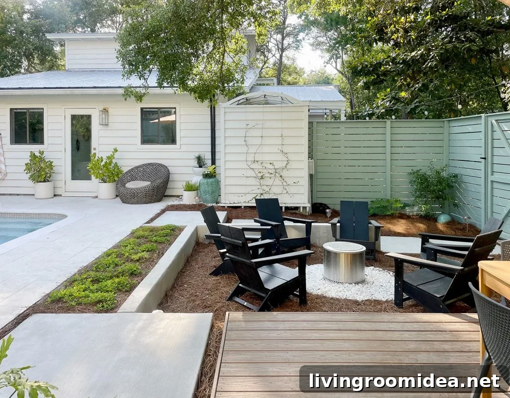 Sunken firepit area in larger backyard next to pool