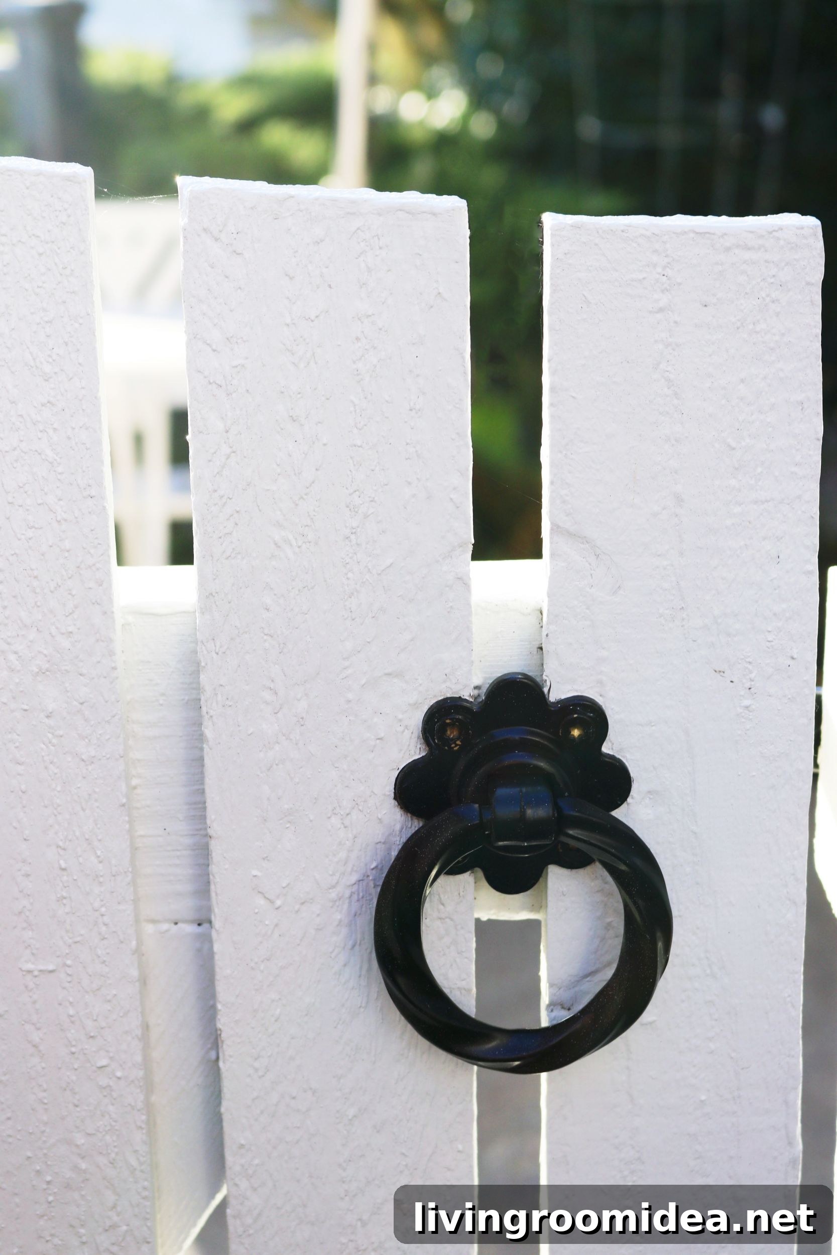 Garden hardware on white picket gates