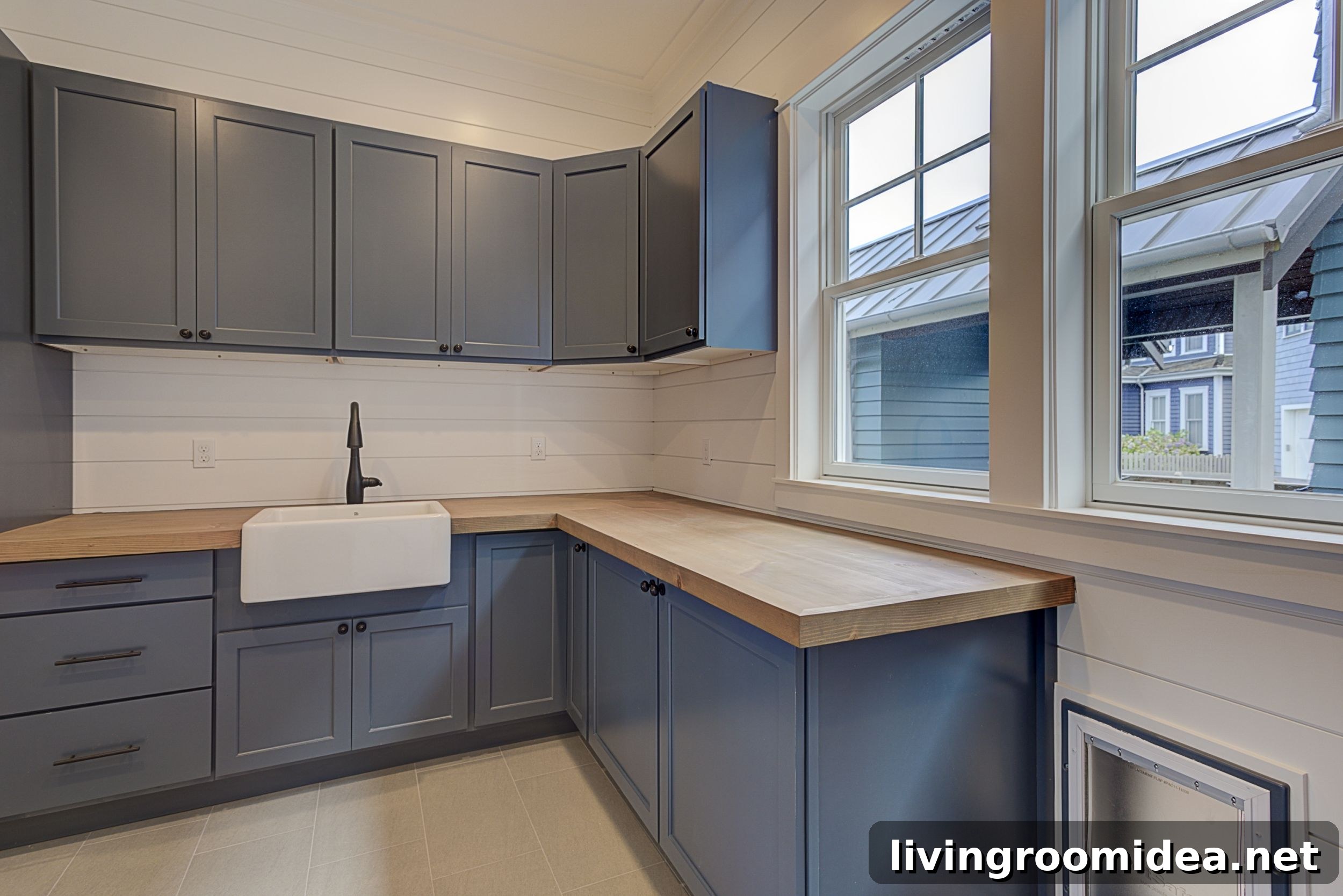 Inside a Dream Beach House in Seabrook: Coastal Home Tour 27 Blue laundry cabinets