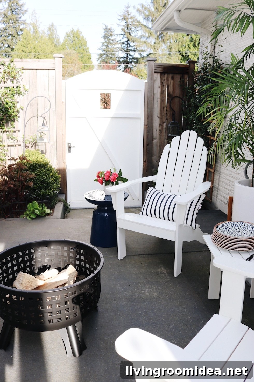 Deck and Patio Refresh: Top Outdoor Favorites for Summer 3 white garden gate and adirondack chair with firepit