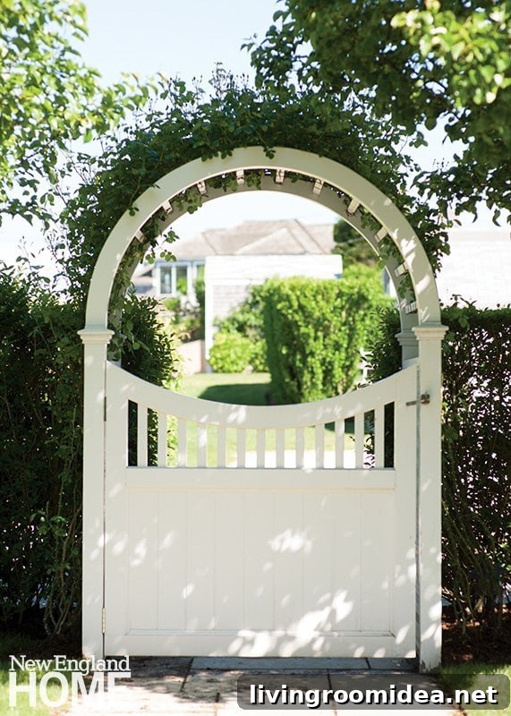 White gate with arbor