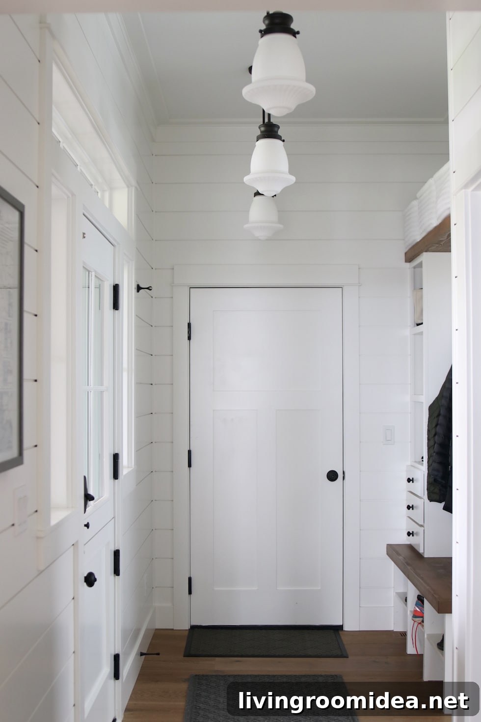 Shingle-Style Beach House Tour in Seabrook, WA 22 Mud room with dutch door and built ins