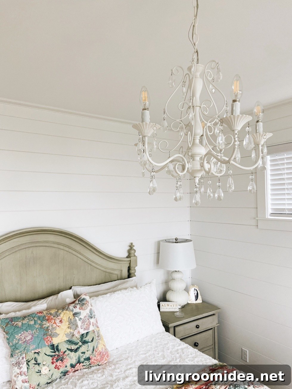Chandelier above bed