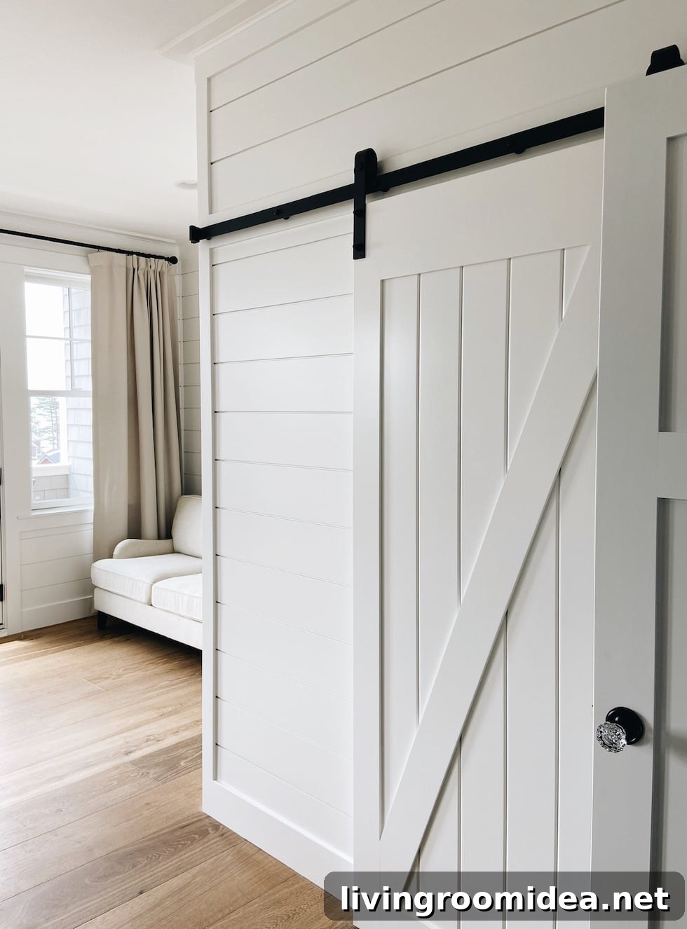 Coastal Dream Home Tour: Upper Levels Walkthrough 9 Barn closet door with shiplap