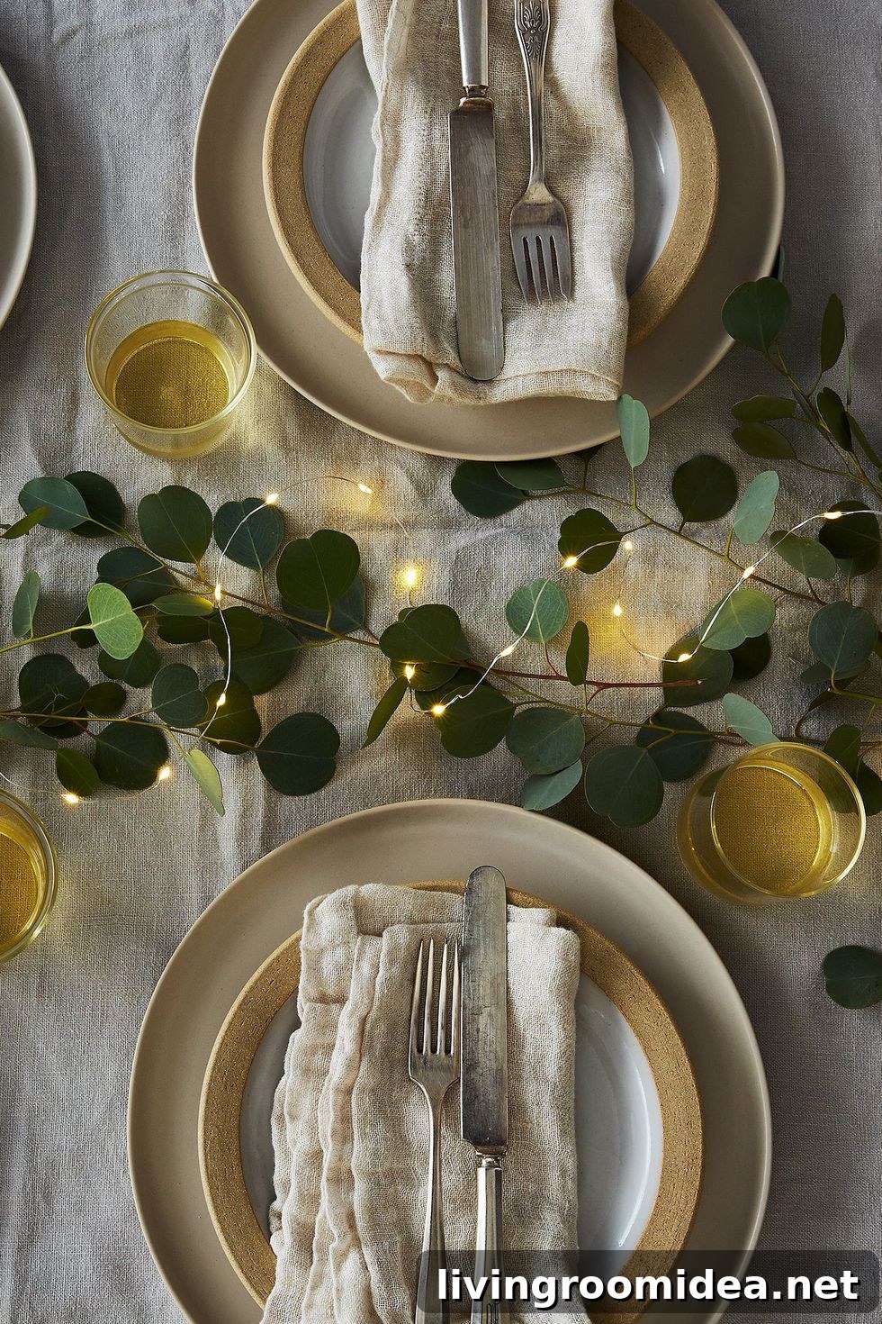 Charming Thanksgiving Table Decor Ideas for a Memorable Meal 9 Linen and gold tones with string lights