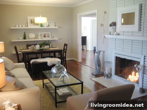 neutral decorating living room and dining room combination with brick fireplace