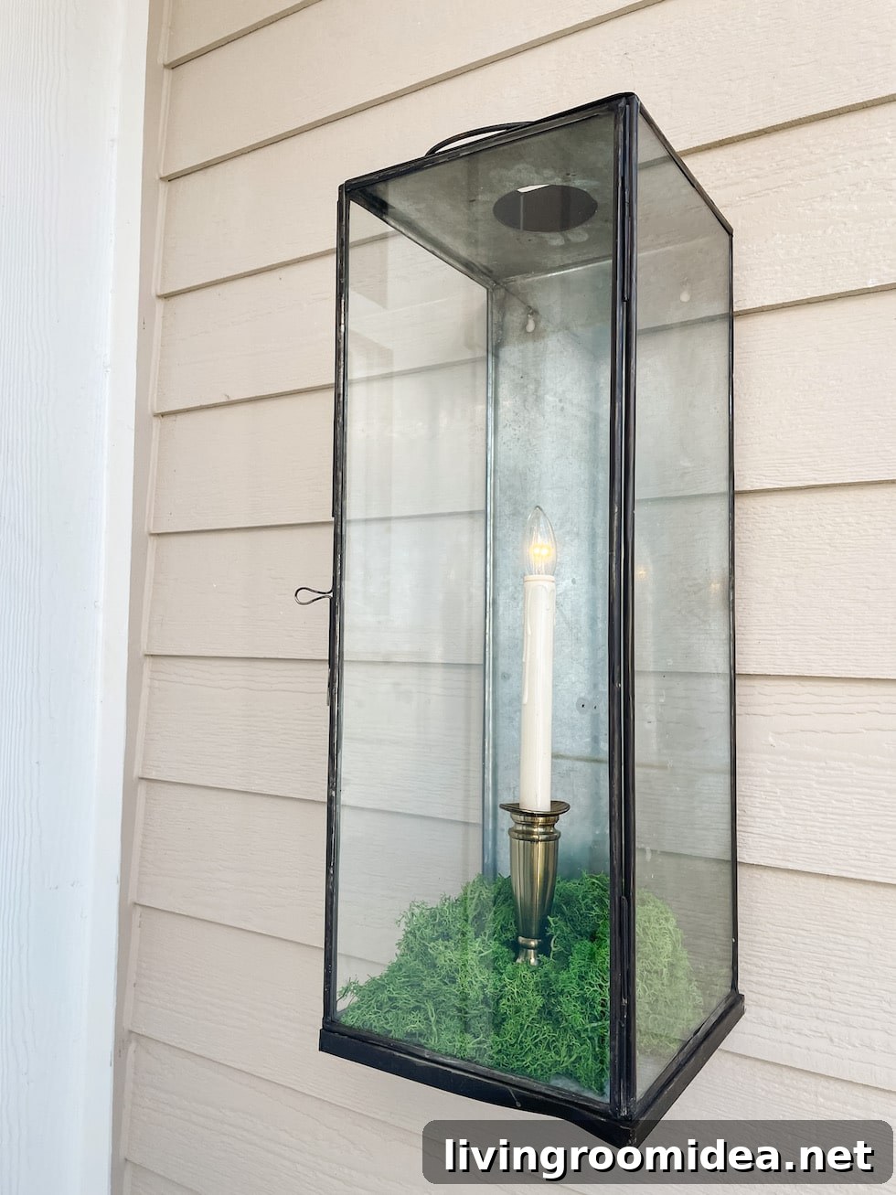 A simple DIY Gas Lantern -- Make a Flickering Candle Wall Lantern, without electricity or gas! You can decorate it for the seasons, too! Find the sources in the post. 