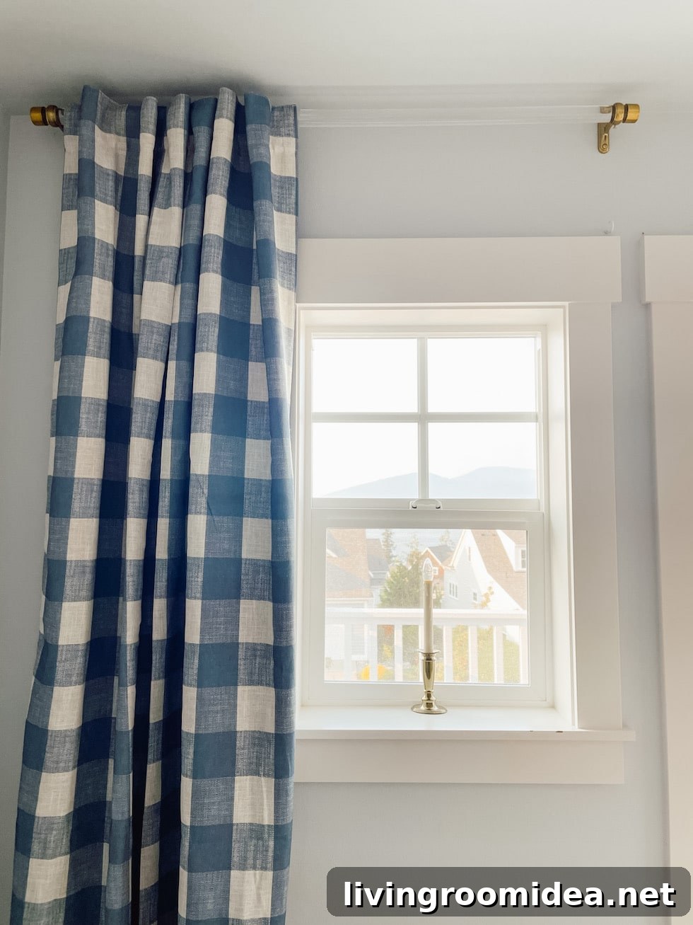 7 Ways We Turned a New House into a Cozy Home in Year One 10 Buffalo checked curtain panels with a clear rod and brass brackets, sources are in linked in the post