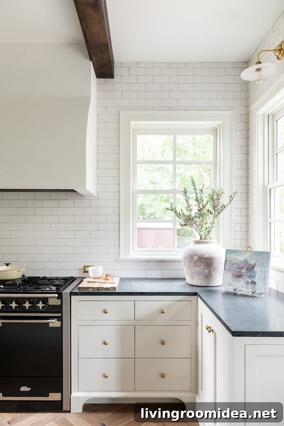 Timeless soapstone counters and white cabinets