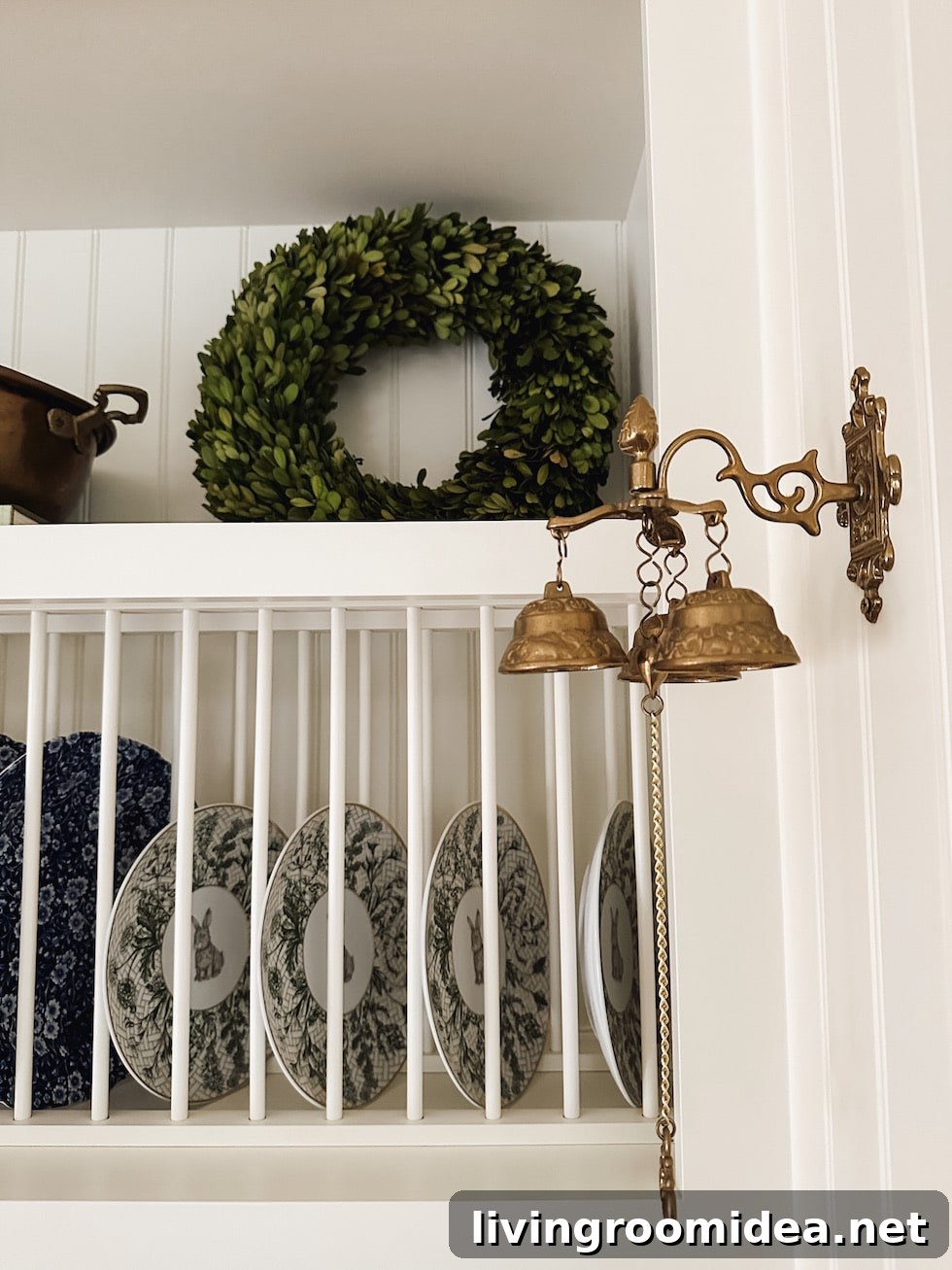 Brass dinner bells  in an English cottage inspired kitchen at Christmas