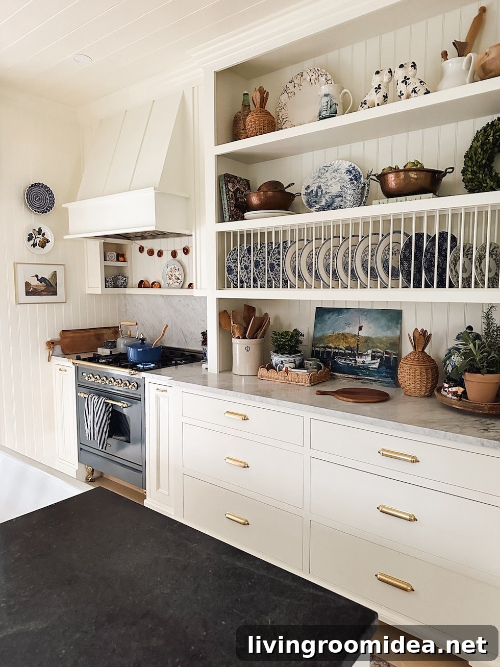English-inspired kitchen with soapstone and marble counters and dish display cabinet 