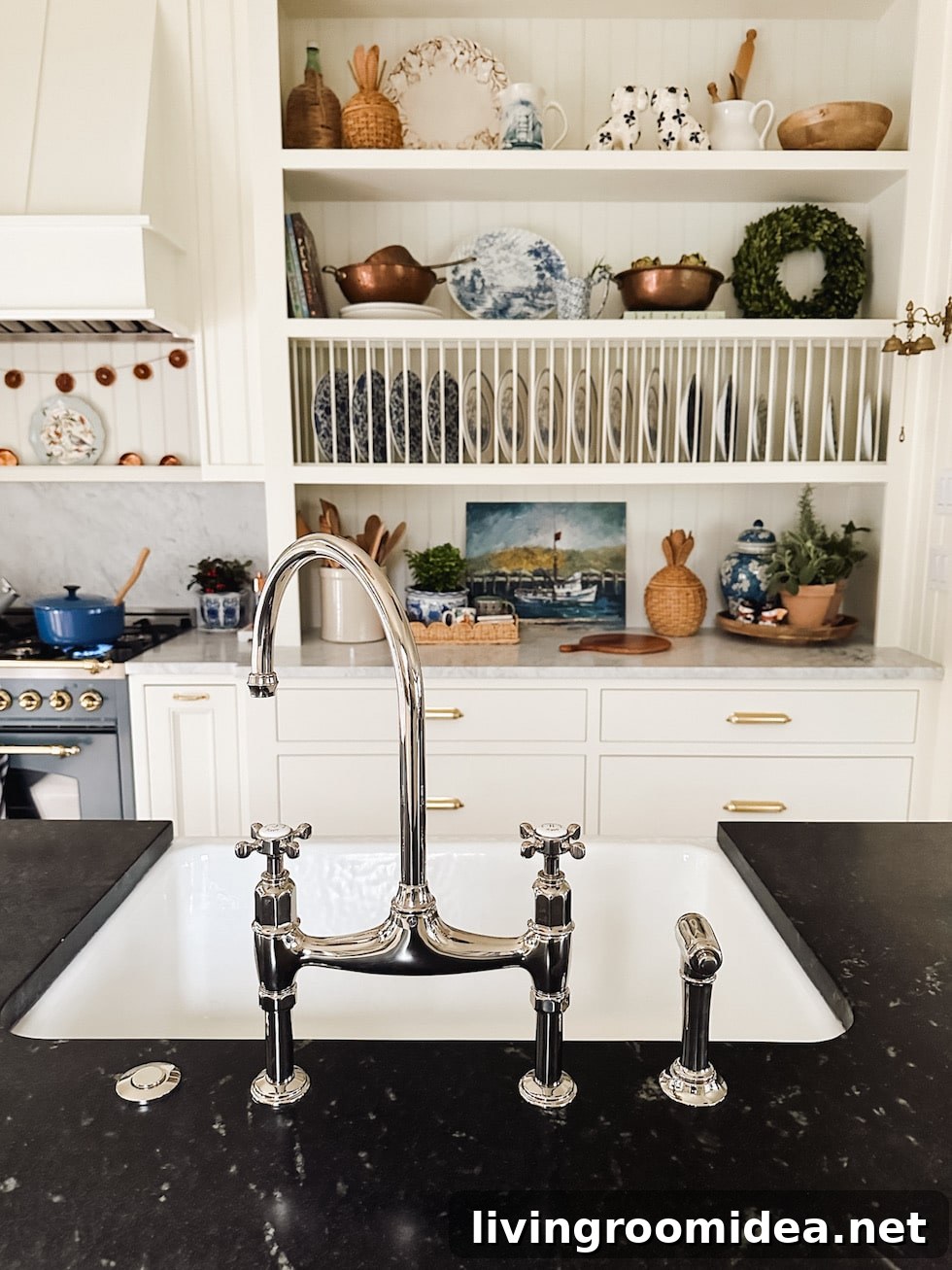 DeVol Tap English-inspired kitchen with soapstone and marble counters in a small coastal home