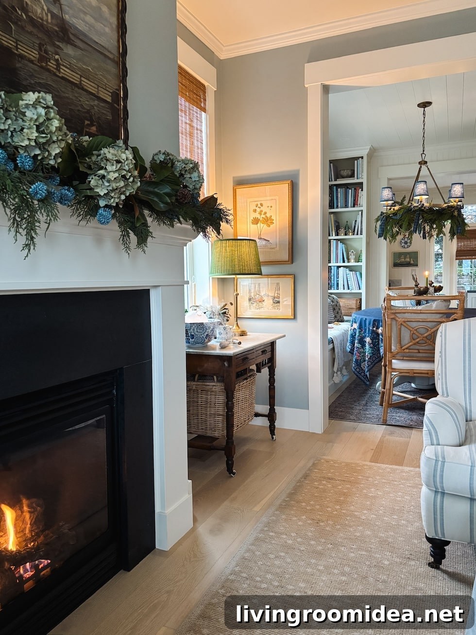 Coastal Cottage Christmas Mantel with Florals and Greenery 6 Wide view of decorated mantel