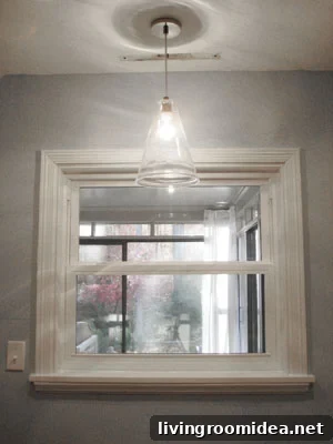Seeded glass pendant over sink