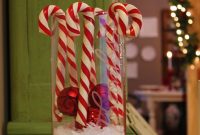 Giant Candy Canes in a Hurricane Vase: Festive Centerpiece Idea