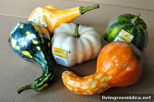 White painted faux gourds on a table