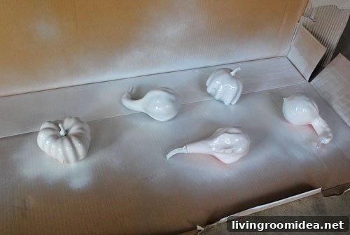 Spray painting faux gourds white