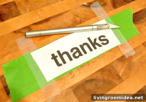 Cutting a homemade stencil of the word THANKS on a cutting board with knife