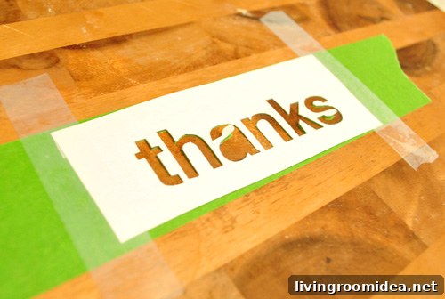 Homemade paper stencil cut out onto painters tape