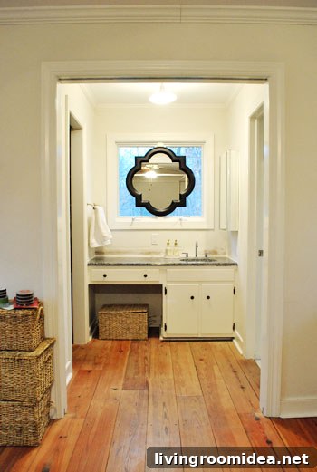 Before - dark framed mirror above sink