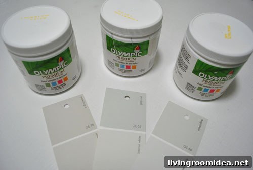 testing three Benjamin Moore gray paint options mixed in Olympic paint test cans - Collingswood Grey Owl and Moonshine