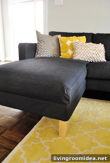 How We Assembled the IKEA Karlstad Sectional Sofa Step-by-Step 11 chaise portion of ikea sectional sofa in dark sivik gray with yellow accents