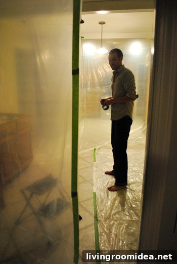 Plastic sheeting over doorway for dust control