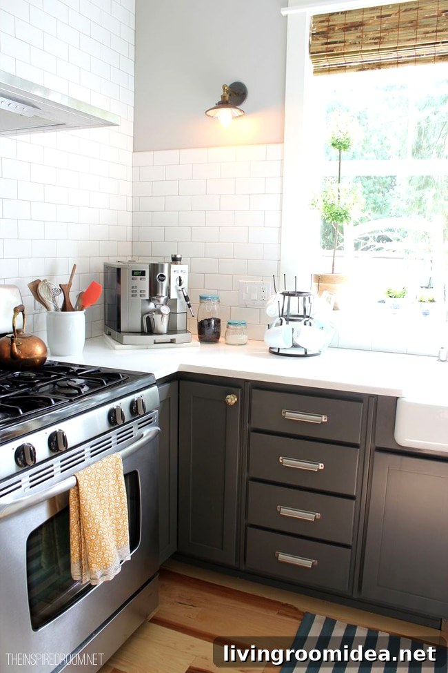 gray kitchen cabinets and white counter with coffee station and mug rack