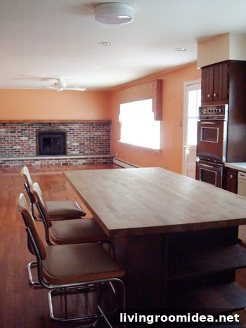 Before image of the room with orange paneling
