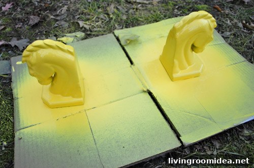 Yellow spray paint on horse heads