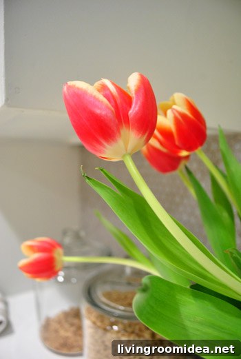 How to Make a Stunning Tulip Bouquet at Home 5 Tulips in a glass hurricane used as a vase