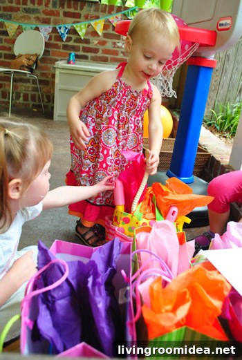 Worm-Themed Birthday Party Ideas and Decorations 17 Child with wooden worm toy
