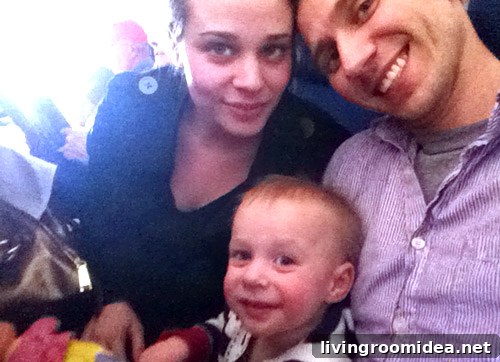 family selfie on airplane with 1 year old