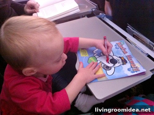 flying with toddler coloring on airplane tray