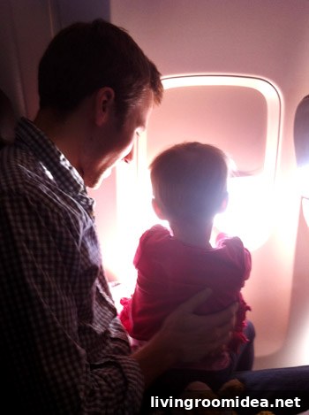 flying with toddler looking out the window