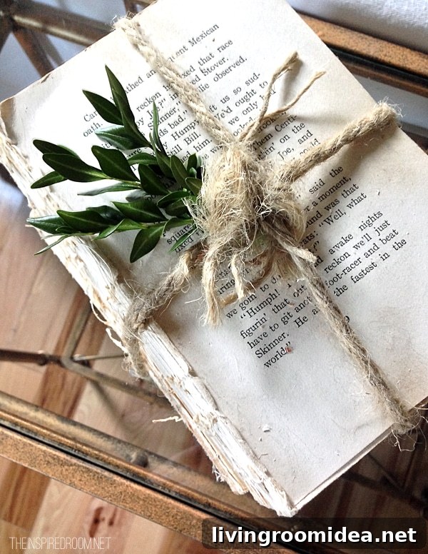 Christmas Decorating boxwood sprigs on book